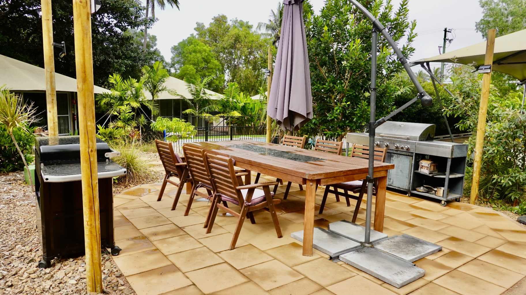 Communal outdoor BBQ and cooking area at Magnetic Glamping