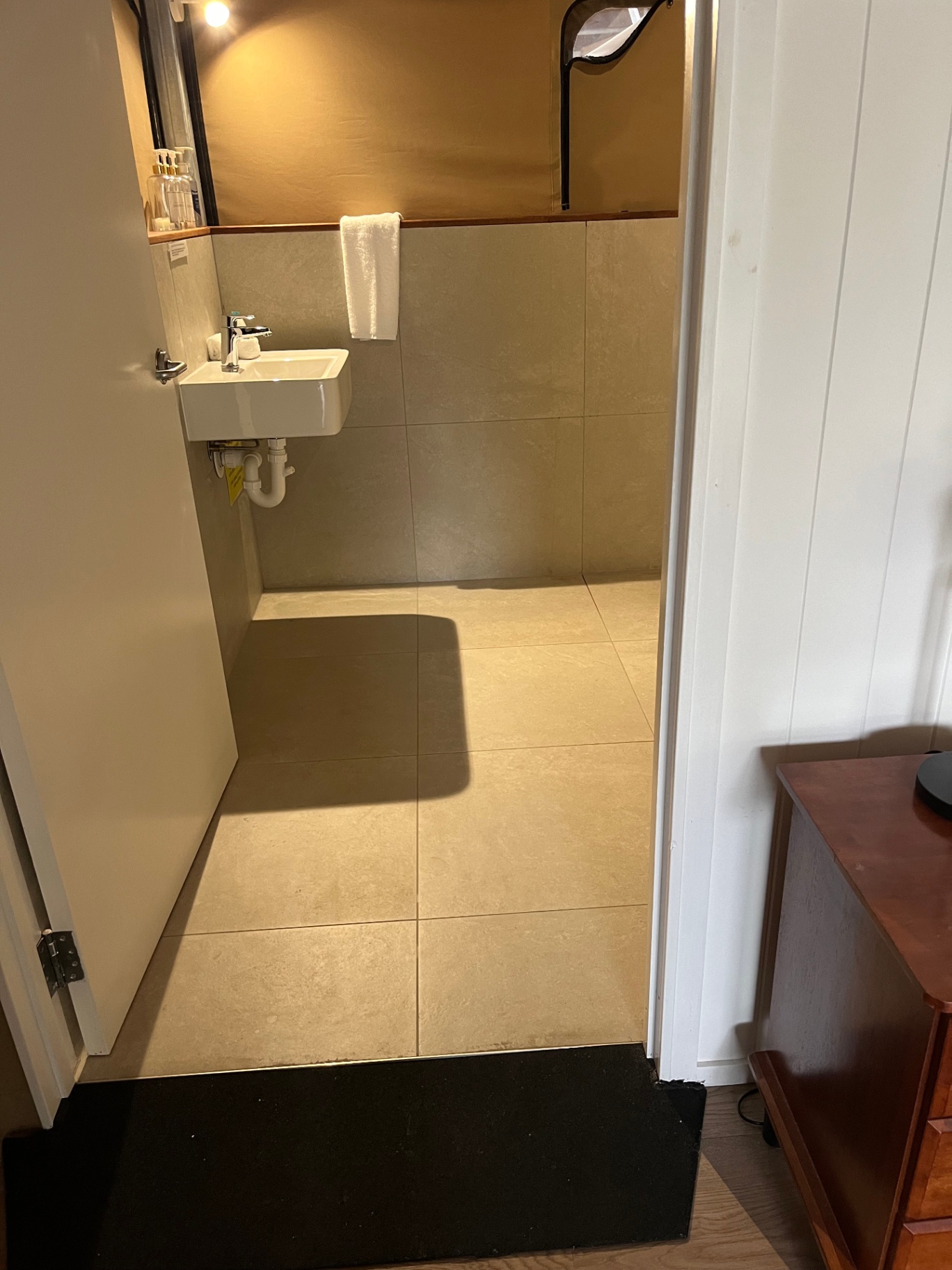 Accessible ramp with handrail from Tent 7 deck to the private bathroom