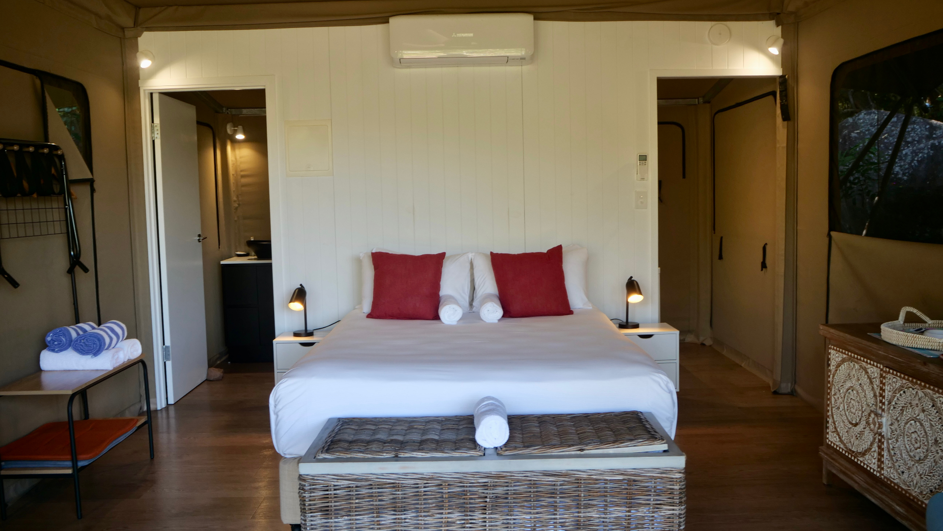 Queen bed with quality linen inside a Magnetic Glamping safari tent