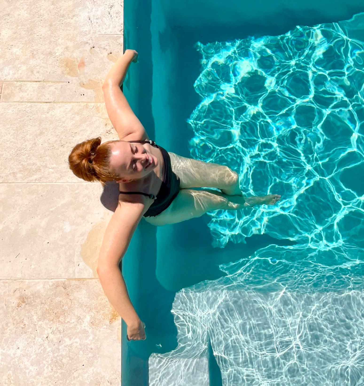Guest relaxing in the magnesium pool at Magnetic Glamping